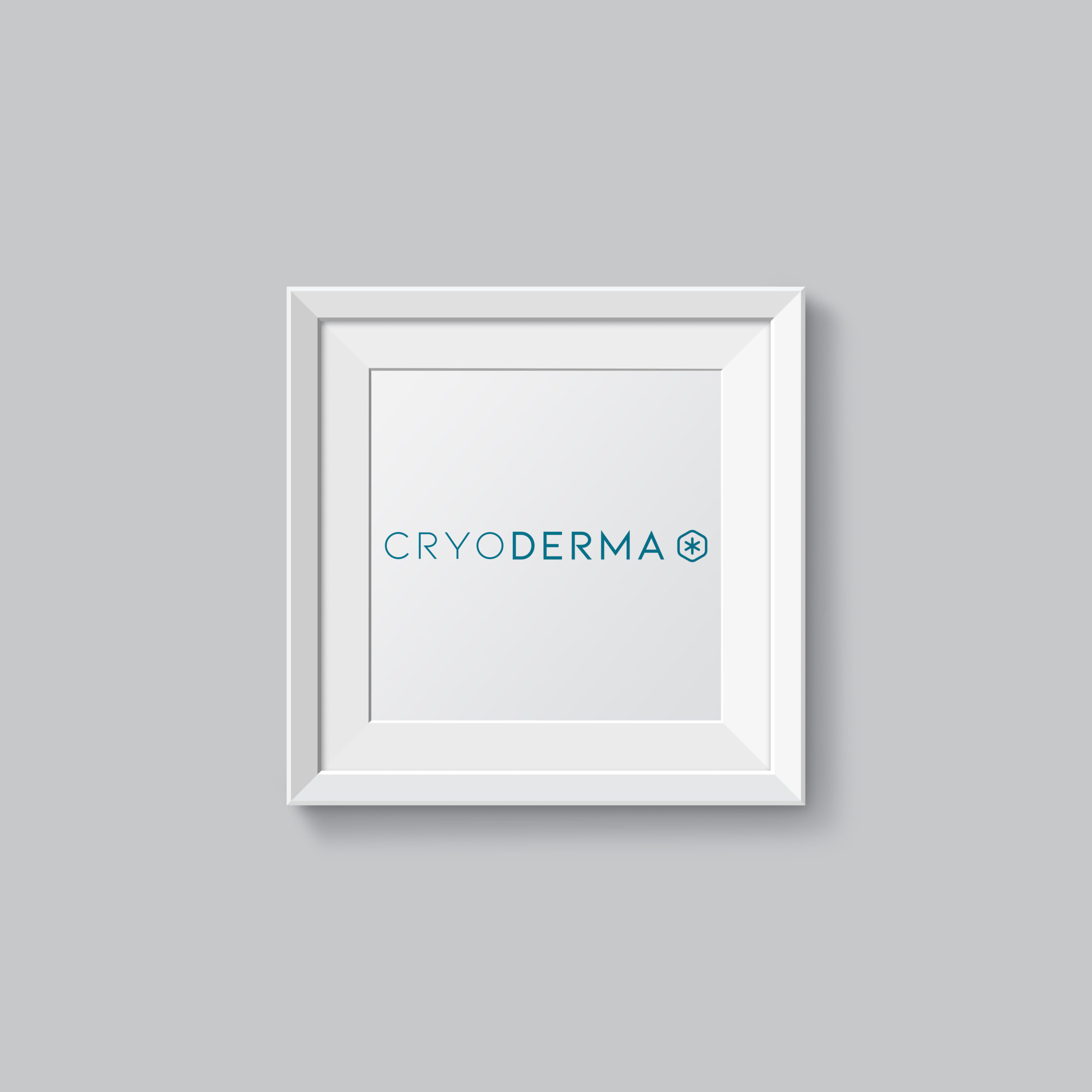 Cadre blanc avec logo Cryoderma accroché sur un mur blanc